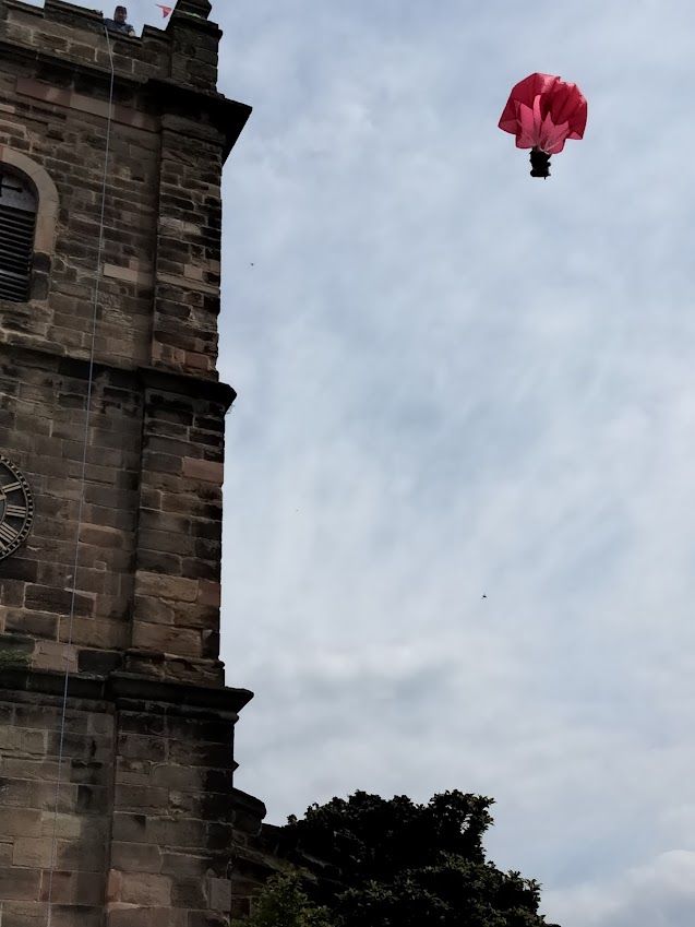 large Teddy parachuting